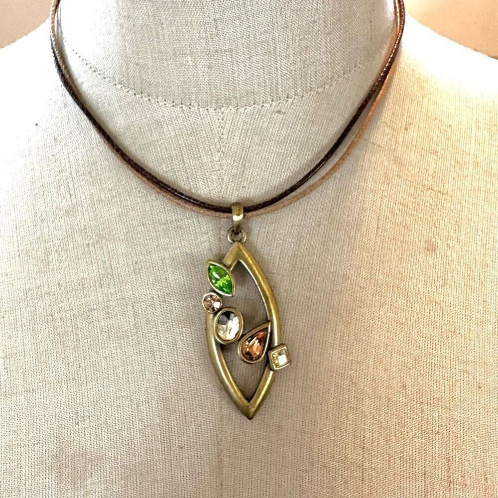 Gold tone rhinestone pendant necklace on cord